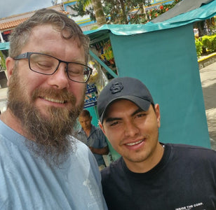 Coffee roaster Mark with farmer Santiago, who grew these beans